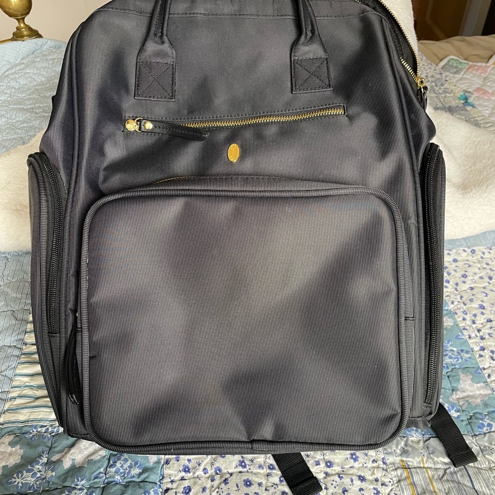 Idaho jones pump backpack-numerous compartments. Never used. Stylish&practical